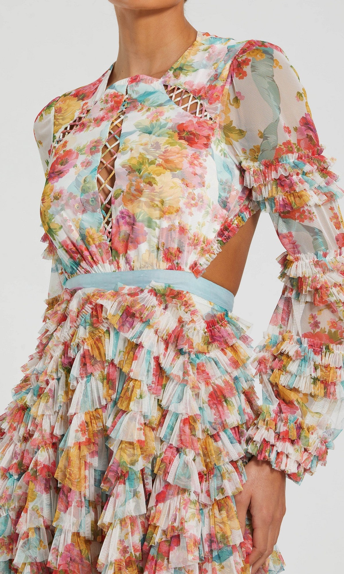 A person wearing the Midi Wedding Guest Dress: Mac Duggal 8130—a long-sleeve floral mesh midi dress with ruffle layers, lattice cutout details, and a fitted waist.